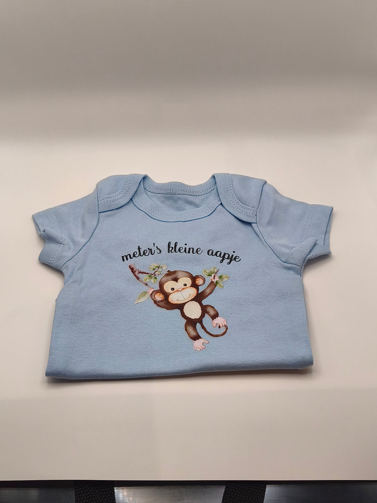 Baby body met dierenopdruk